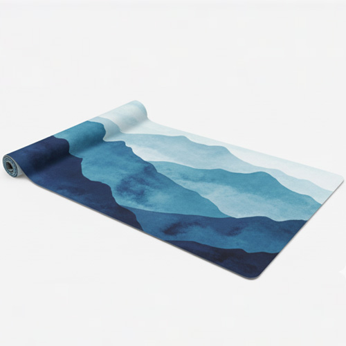 A beautiful suede yoga mat printed with a serene watercolor landscape of layered blue mountain ranges, evoking a sense of calm and tranquility.