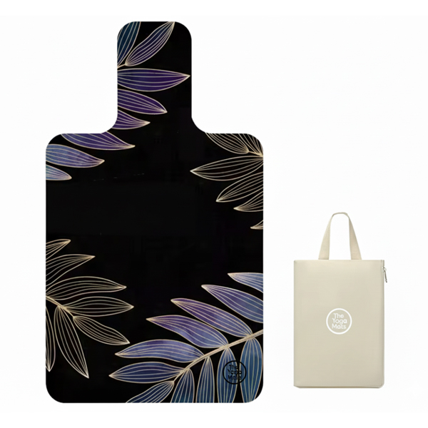 An elegant black Pilates reformer mat with a gold and purple botanical leaf design, paired with a matching tote bag.