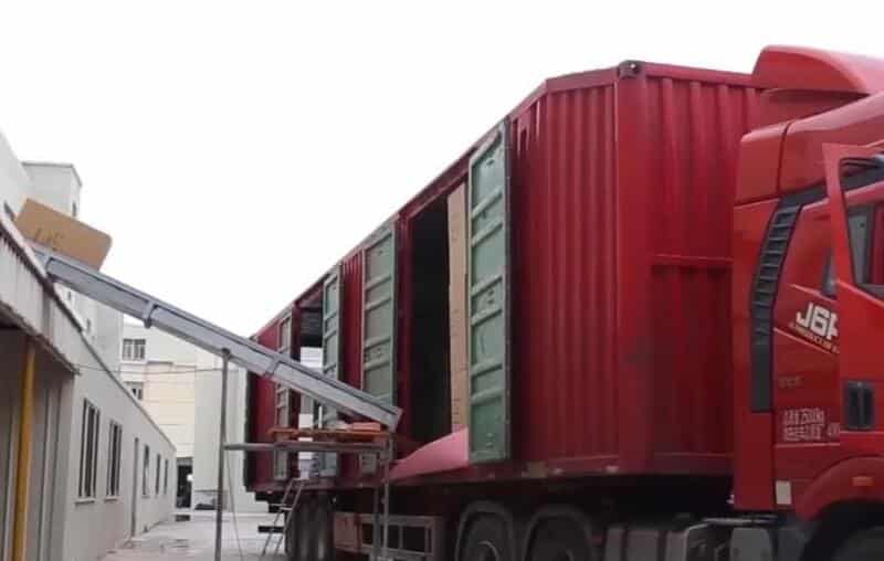 Loading bulk yoga mat orders into containers for global shipping.