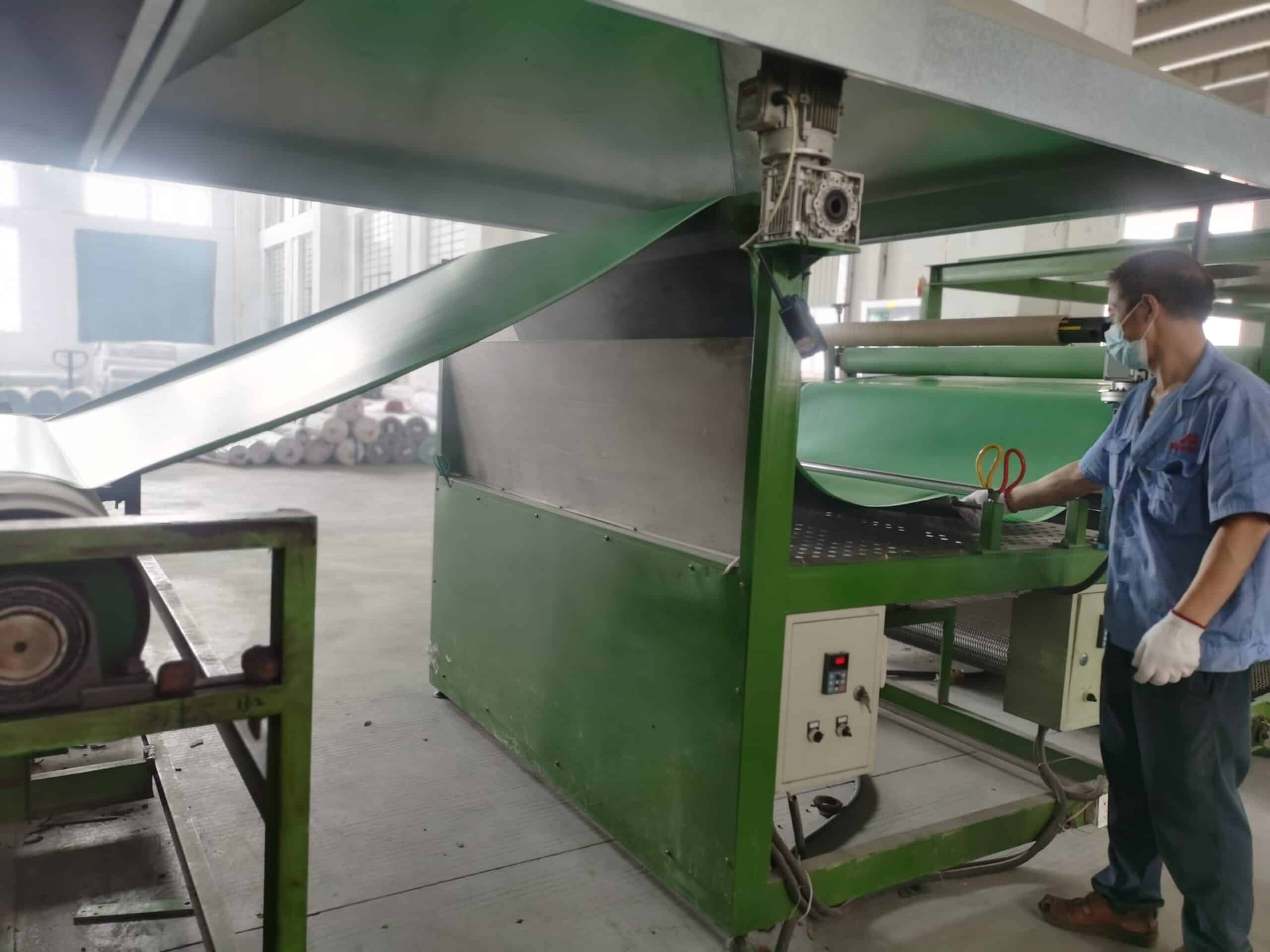 Industrial rubber foaming machine processing natural rubber base for yoga mats.